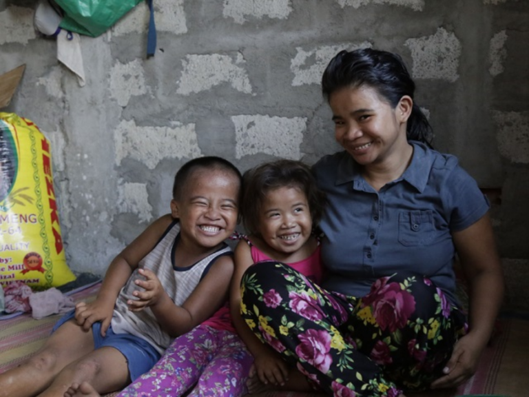 save the children photo mother with her two children